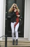 Kate Moss in very tight jeans exits a friend's house in London
