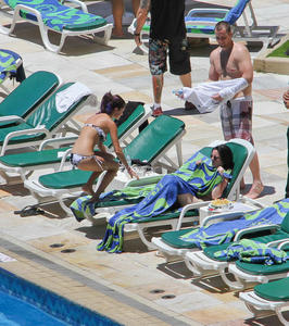 th 800492163 Celebutopia netSelenaGomez20 122 260lo Selena Gomez gets a Brazilian tan while at a pool at her hotel in Rio 2 4 12 x36