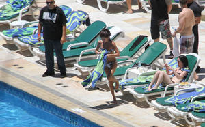 th 800437571 Celebutopia netSelenaGomez10 122 507lo Selena Gomez gets a Brazilian tan while at a pool at her hotel in Rio 2 4 12 x36