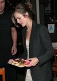 Keri Russell serves pastries to papps outside Taste Restaurant